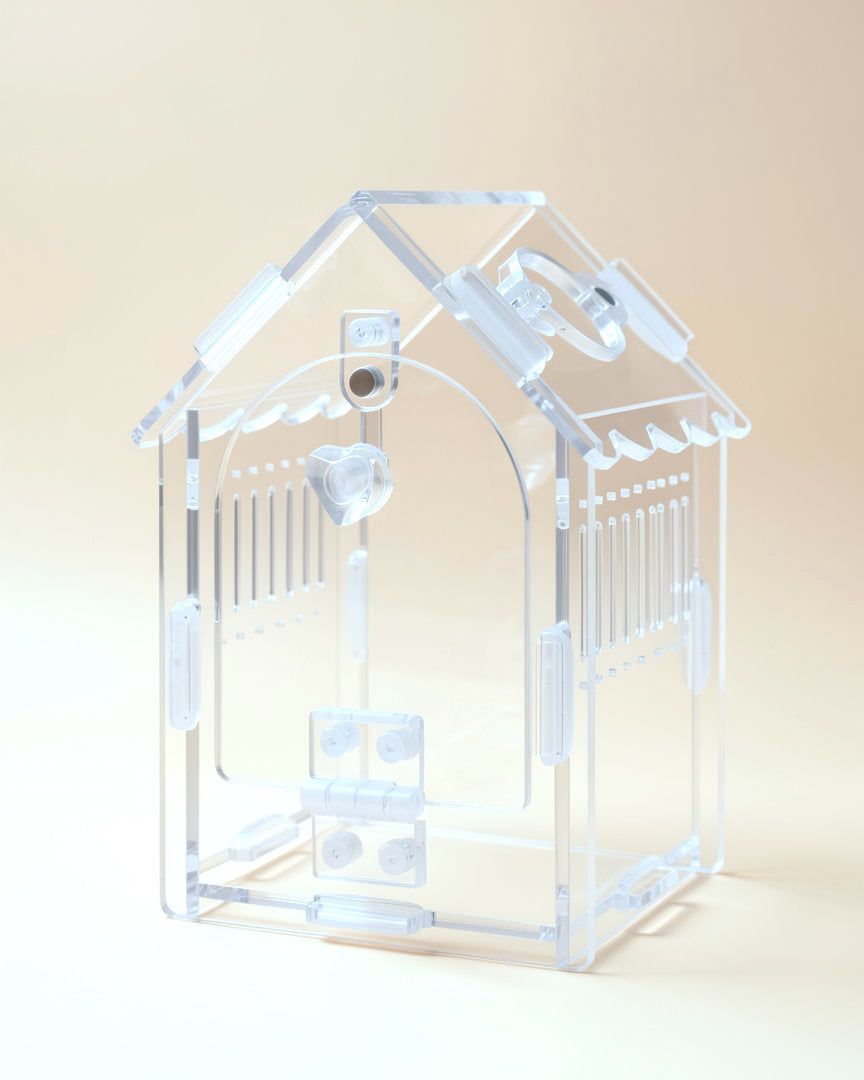 Acrylic jumping spider house, empty, front view with the door closed, studio photo