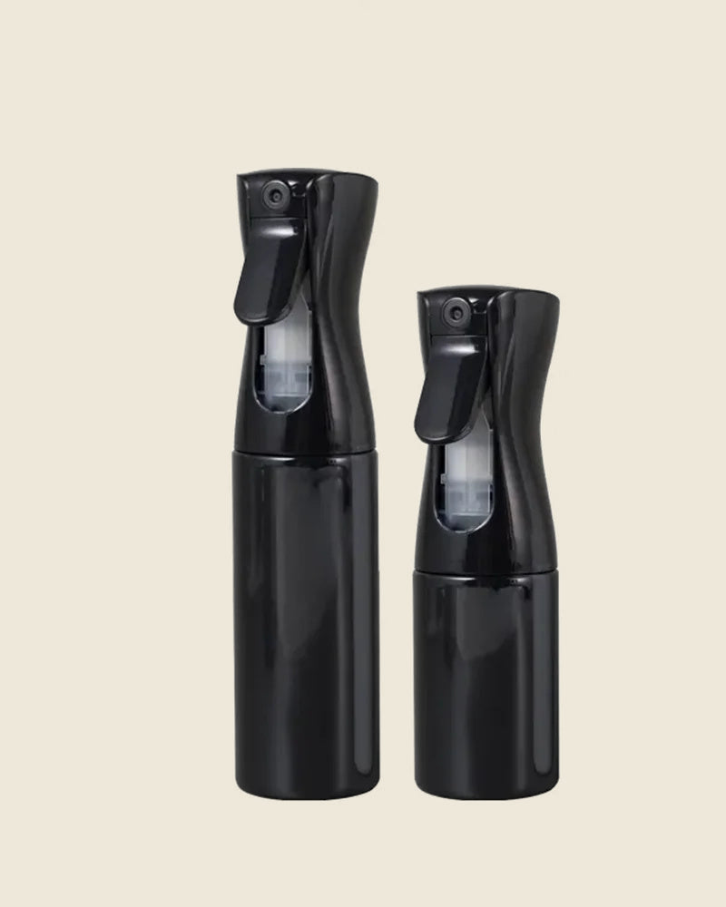 Continuous mist spray bottle in black, 300 ml and 200 ml, studio photo